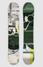 A snowboard shown from both sides against a light gray background. The left side features a complex collage print with black, white, and gray graphics, while the right side features a dark green base with white graphic elements and accents of yellow, blue, and purple near the bottom.